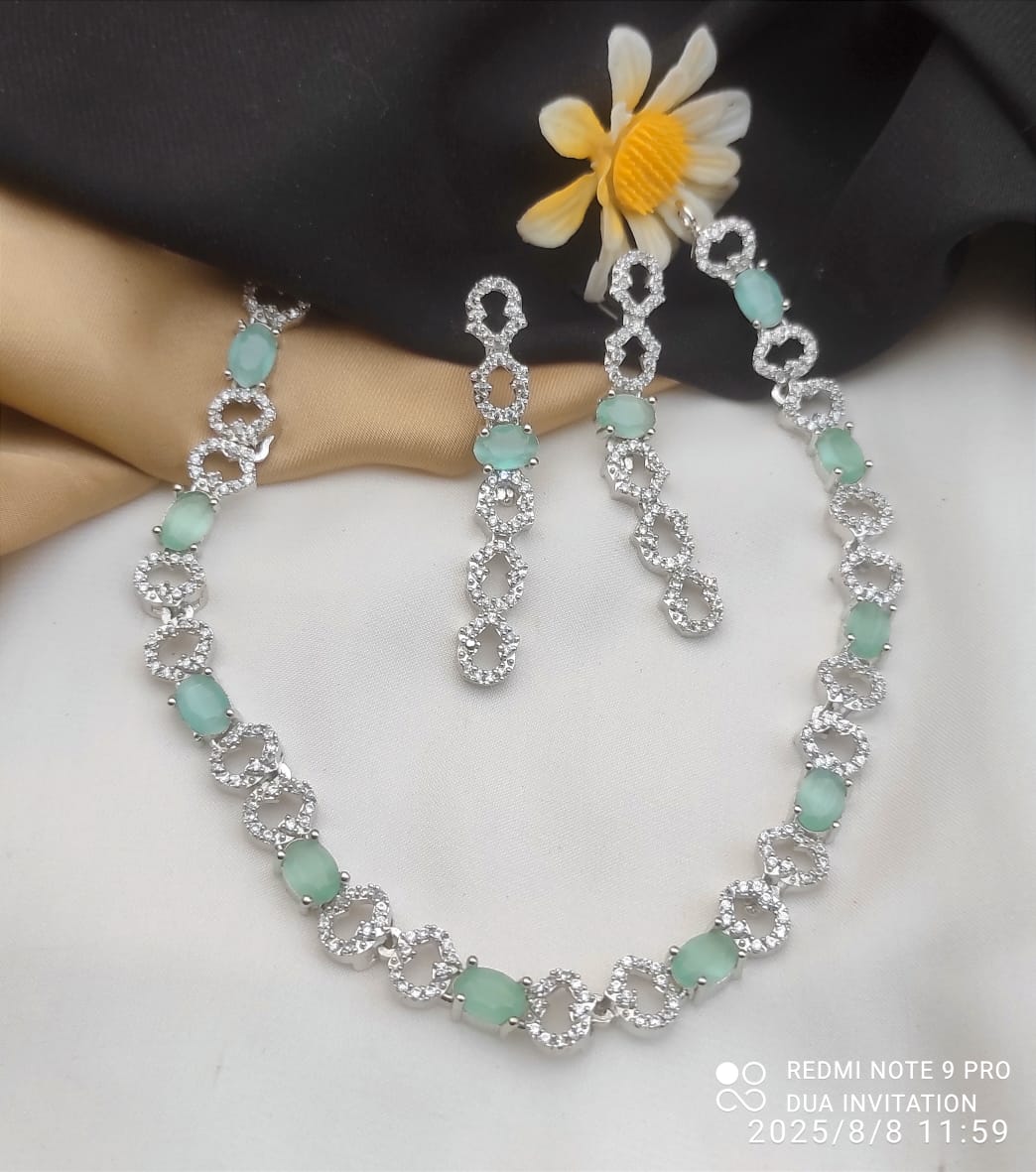Necklace and Matching Earrings Adorned With Stones and Clear Cubic Zirconia.