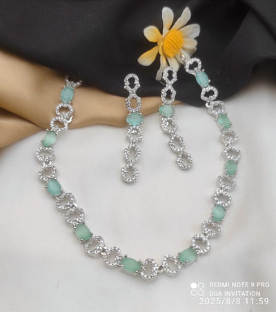 Necklace and Matching Earrings Adorned With Stones and Clear Cubic Zirconia.